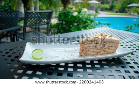 Lemon pie with cookies in a table