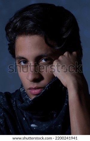 portrait of young man looking at the camera Royalty-Free Stock Photo #2200241941