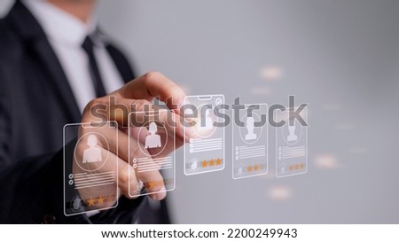 Human Resources HR management Recruitment Employment Headhunting Concept, Human Resources uses computers to search and select job applicants The process of selecting people to join the work of HR. Royalty-Free Stock Photo #2200249943