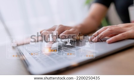 Human Resources HR management Recruitment Employment Headhunting Concept, Human Resources uses computers to search and select job applicants The process of selecting people to join the work of HR. Royalty-Free Stock Photo #2200250435