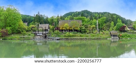 Panoramic scenery of an old thatched village surrounded by fresh greenery at Gifu pref.