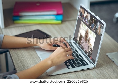 Composition of caucasian businesswoman having video call with colleagues in office. Global business and digital interface concept digitally generated image.