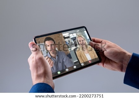 Caucasian businessman having video call with colleagues. Global business and digital interface concept, digital composite image.