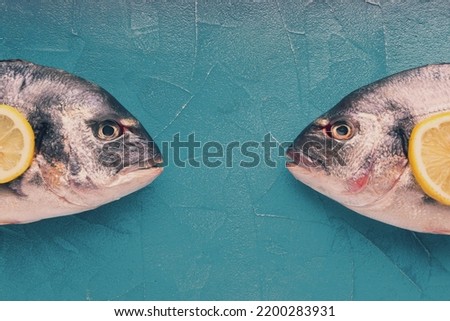 Flat lay fishes white background Royalty-Free Stock Photo #2200283931