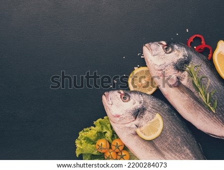 Flat lay fishes white background Royalty-Free Stock Photo #2200284073