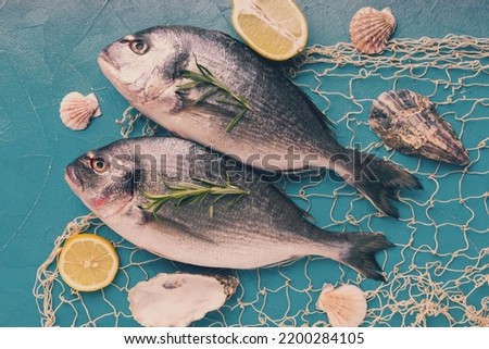 Flat lay fishes white background Royalty-Free Stock Photo #2200284105
