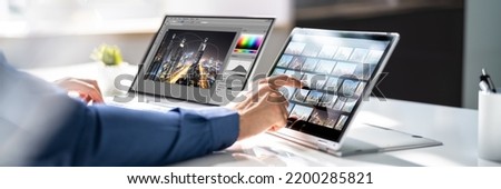 Graphic Designer Editing Photo On Laptop Computer