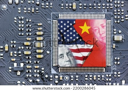 Flag of USA and China on a processor, CPU or GPU microchip on a motherboard. US companies have become the latest collateral damage in US - China tech war. US limits, restricts AI chips sales to China. Royalty-Free Stock Photo #2200286045