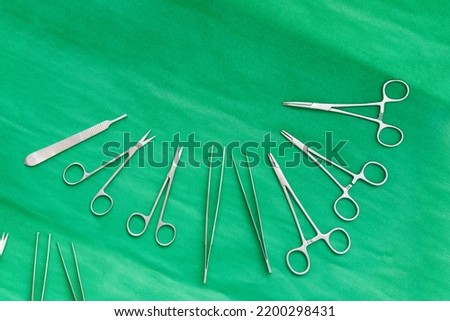 suegery medical tools for doctor operation on green dress