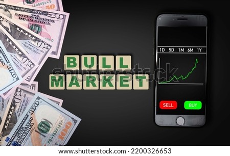 phone stock price chart next to US dollars and Bull market