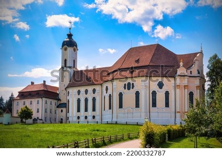 The Pilgrimage Church of Wies (German: Wieskirche) is an oval rococo church in the Bavarian Alps on a sunny day, Bavaria, Germany) Royalty-Free Stock Photo #2200332787