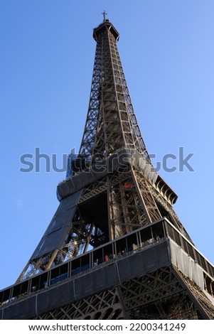 Eiffel Tower Under Construction with Blue Sky Background.