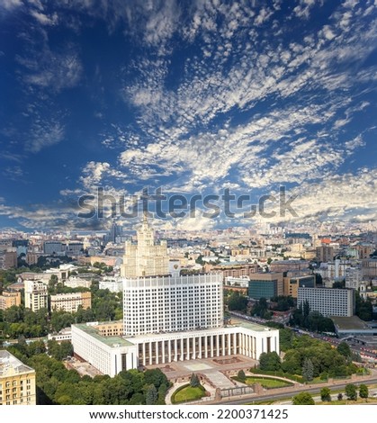 Aerial view of Moscow against the background of the sky with clouds. Government House of the Russian Federation (White House)-written in Russian, Russia  