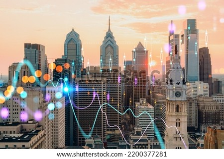 Aerial panoramic skyline of Philadelphia financial downtown, Pennsylvania, USA. City Hall Clock Tower at sunset. Forex candlesticks and bar graph hologram. The concept of internet trading, brokerage