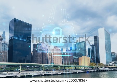 New York City skyline, United Nation headquarters over the East River, Manhattan, Midtown at day time, NYC, USA. The concept of cyber security to protect confidential information, padlock hologram Royalty-Free Stock Photo #2200378367