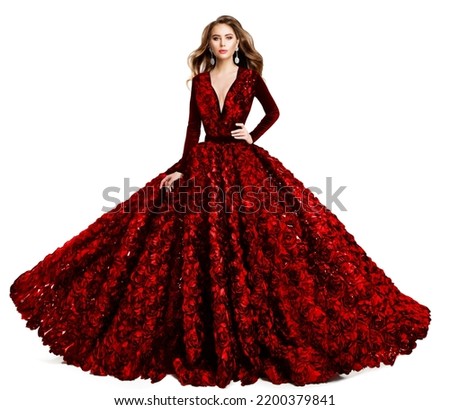 Fashion Model in Red Evening Dress. Beautiful Woman in Princess Ball Gown and Curly Hairstyle. Elegant Lady in Luxury Wedding Dress with Rose Flower over White Studio Background Royalty-Free Stock Photo #2200379841