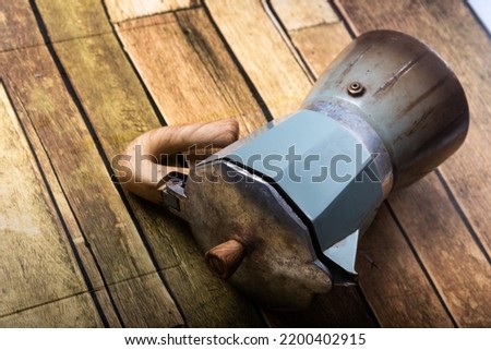 Mocha port coffee maker on wooden floor high resolution photography