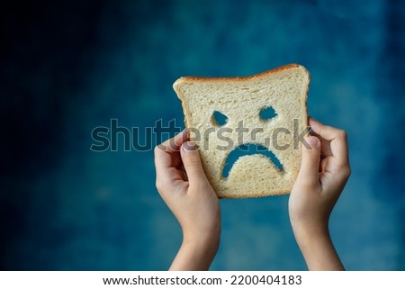 Gluten free bread in hands of child. Celiac disease. Banner for cite celiac