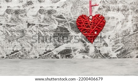 Rattan work of heart shape on grey background wall. Copy space