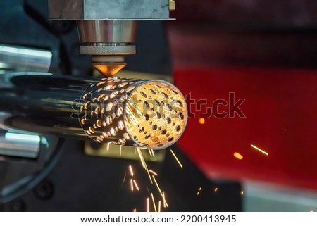 The fiber laser cutting machine cutting  machine cut the stainless steel tube. The hi-technology sheet metal manufacturing process by laser cutting machine.  Royalty-Free Stock Photo #2200413945