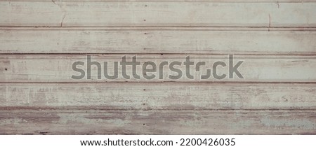 Panoramic Vintage Light Rustic Wood Background. Old painted wooden wall with cracked paint close up. Abstract Grunge Web banner Texture With Space For Design. Weathered wooden Surface