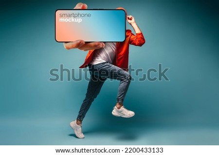 cool guy Iphone posing blue background jumping iPhone mockup