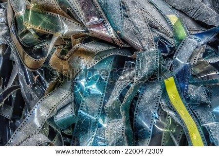 Image of a pile of spent photographic film abandoned inside an abandoned factory.