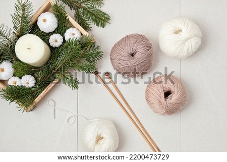 Craft hobby background with yarn in natural colors. Recomforting hobby to reduce stress for cold fall and winter weather. Mock up, copy space, top view Royalty-Free Stock Photo #2200473729