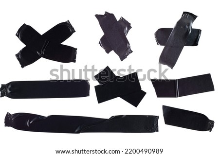 Black insulating tape on white isolated, different shapes of pieces of tape, high resolution.