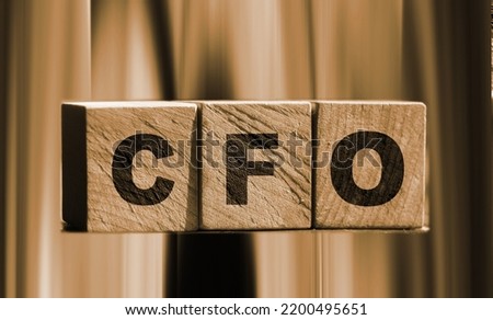 concept word CFO on cubes on a wooden background.
