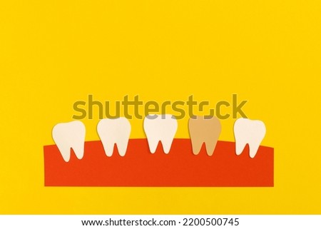 White teeth made from paper. Dental health care concept.