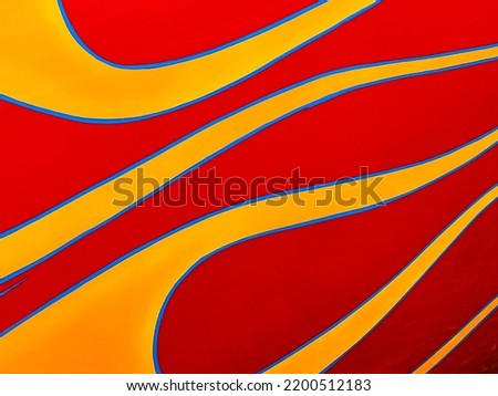 Closeup of a classic car hot rod paint job with flames, suggesting climate change and fossil fuels.