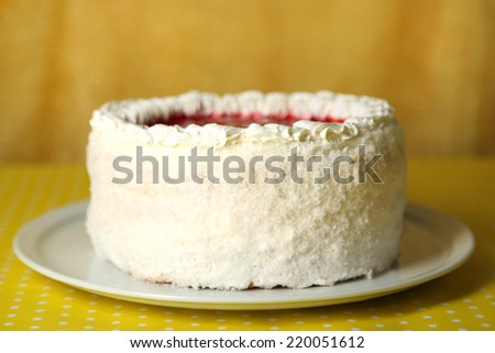 White cake on yellow background