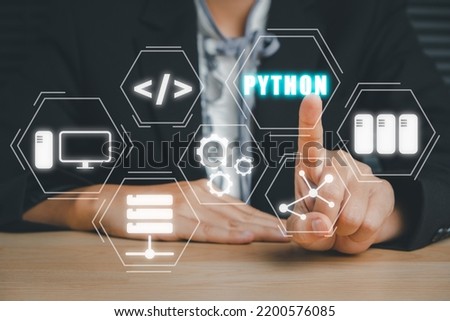 Python Programming Language, Woman hand touching python programming icon on virtual screen, Application and web development concept. Royalty-Free Stock Photo #2200576085