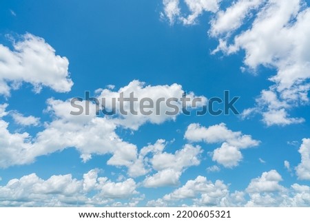 Beautiful blue sky and white cumulus clouds abstract background. Cloudscape background. Blue sky and fluffy white clouds on sunny day. Nice weather. Beauty cumulus cloudscape. Summer sky weather. Royalty-Free Stock Photo #2200605321