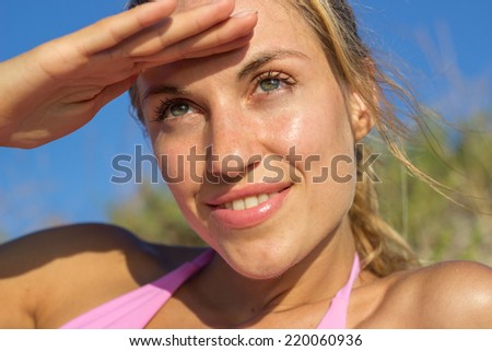 Woman face on sunny day at beach