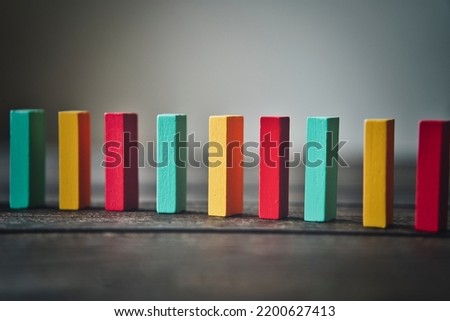 Background material with colorful dominoes lined up in a row