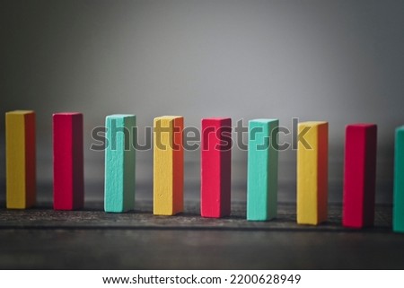 Background material with colorful dominoes lined up in a row