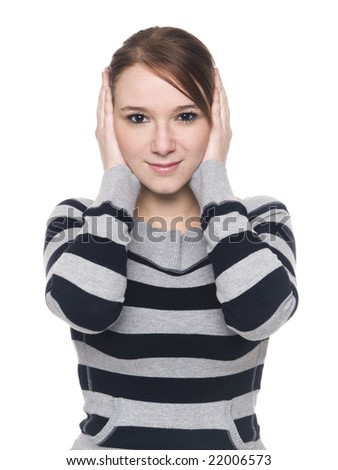 Isolate studio shot of a casually dressed young adult woman in the Hear No Evil pose.
