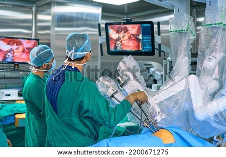surgeons perform surgery using a robot Royalty-Free Stock Photo #2200671275