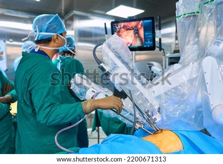 surgeons perform surgery using a robot Royalty-Free Stock Photo #2200671313