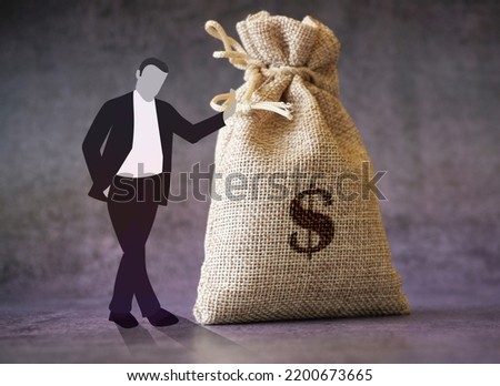Business man standing with dollar bag stock photo Business concept