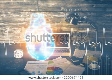 Desktop computer background and heart drawing. Double exposure. Medical study and healthcare concept.