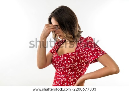 Young woman feeling pain with eyes closed with headache put hand to head isolated on white background. hands by the head. migraine. headache Royalty-Free Stock Photo #2200677303