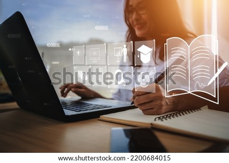  young woman with learning language during online courses using netbook , 

e-learning education concept, learning online with webinar, video tutorial, internet lessons Royalty-Free Stock Photo #2200684015
