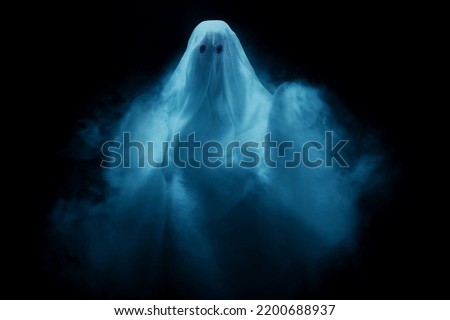 White ghost on dark background Royalty-Free Stock Photo #2200688937