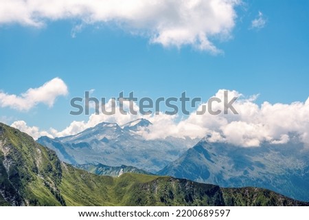 View from Kreuzeck summit (2,204 m) to the Hochalmspitze.  It is sometimes called "Tauern Queen" (Tauernkönigin) and at 3,360 m the highest mountain in the Ankogel group. Austrian Alps in summer. Royalty-Free Stock Photo #2200689597