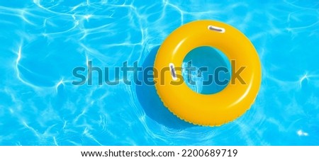 Inflatable ring in swimming pool, top view. Banner for design Royalty-Free Stock Photo #2200689719