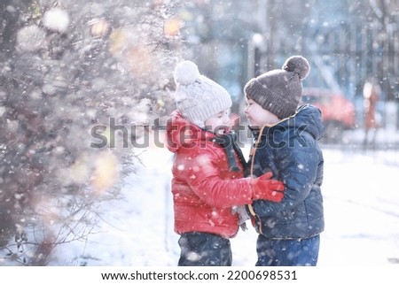 Kids walk in the park with first snow Royalty-Free Stock Photo #2200698531