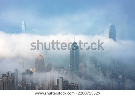 Skyscraper in downtown of Hong Kong city in fog